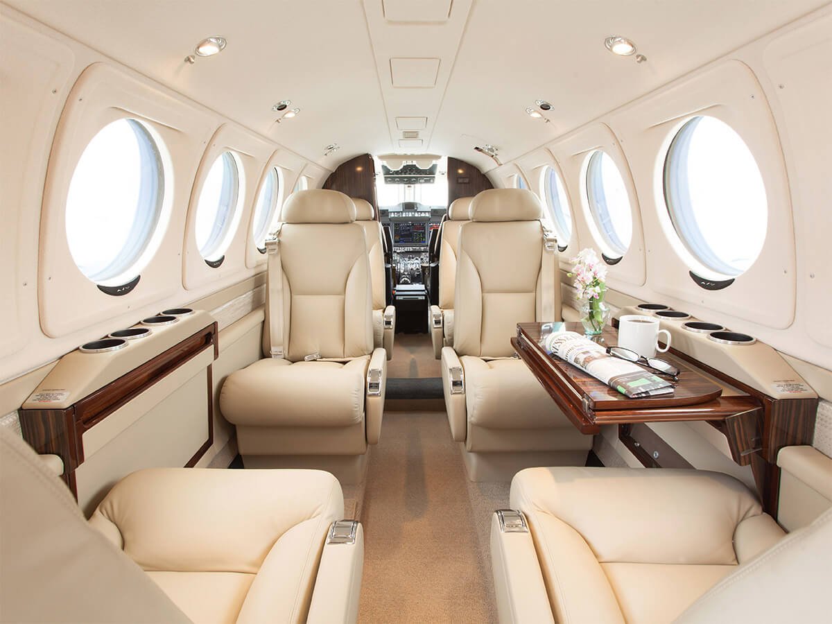 Beechcraft King Air cabin with writing desk unfolded.